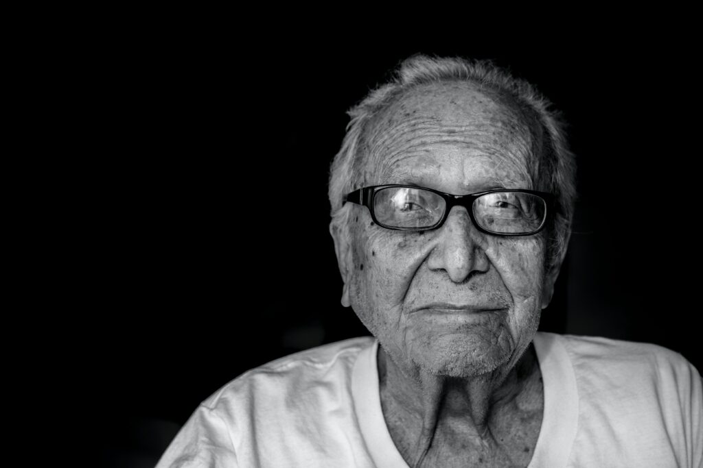 older man with glasses