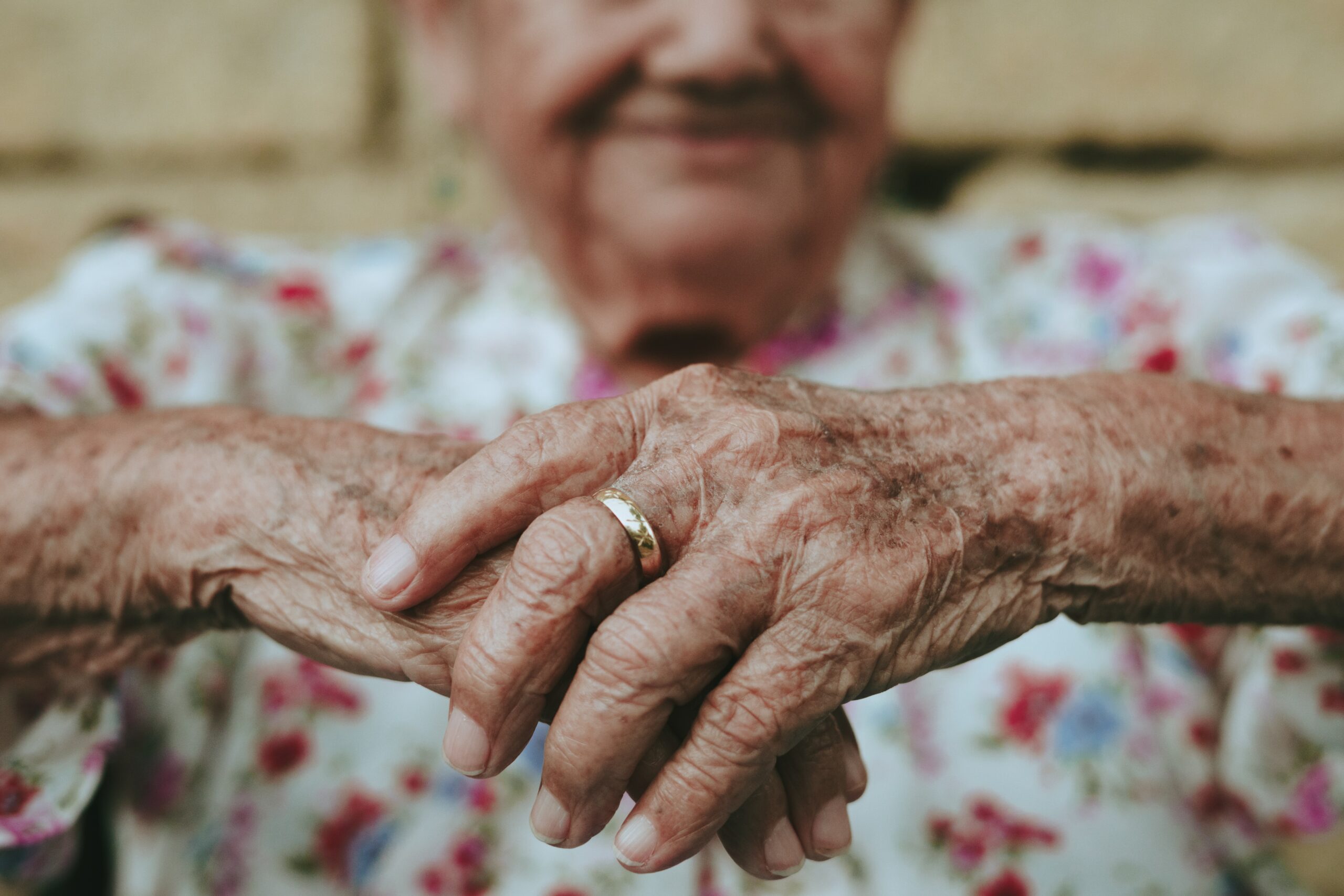 older woman's hands with wedding ring